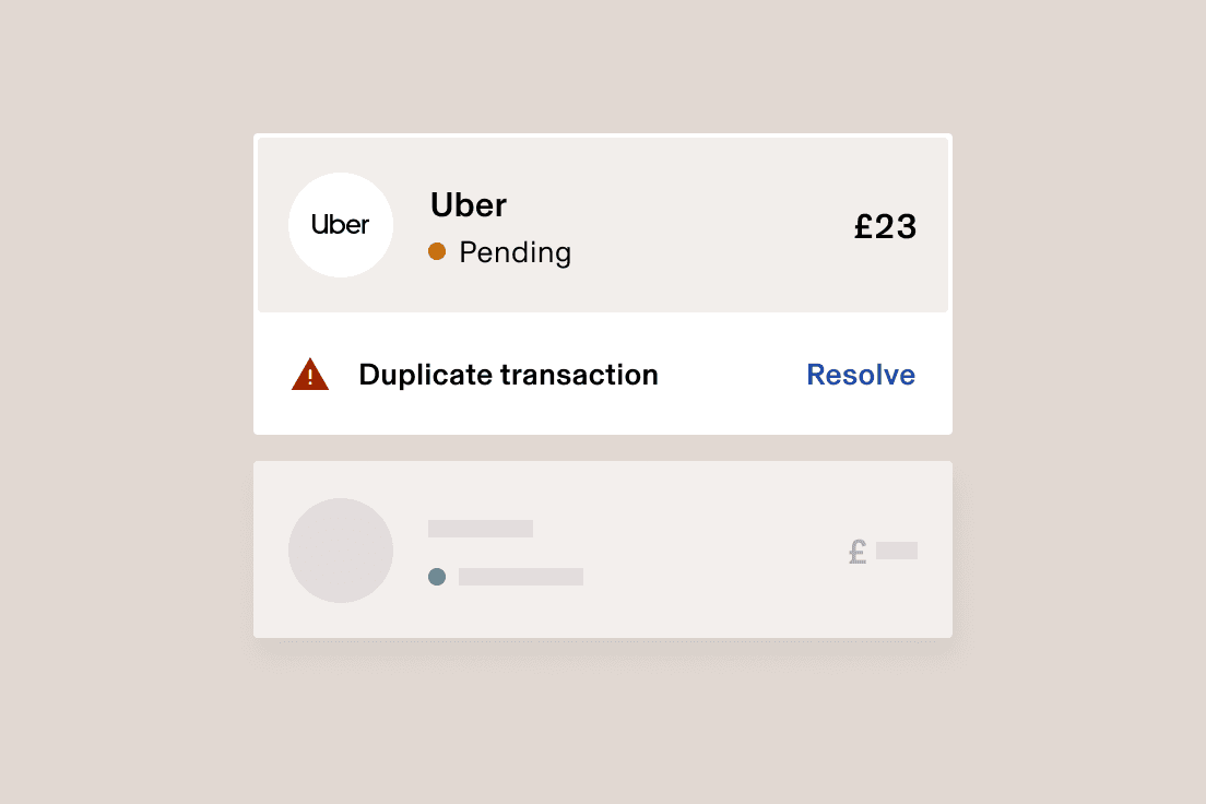 Uber payment interface showing a pending $23 transaction with a duplicate transaction warning and resolve option.